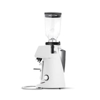 A white electric coffee grinder with a clear hopper and black accents, shown from a side profile on a white background.