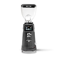 A professional electric coffee grinder with a dark gray body, clear hopper, and digital touch screen interface, shown on a solid white background.